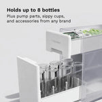 White drying rack drawer with bottles and pump parts on a light gray background, text indicating "Hold up to 8 bottles, plus pump parts, sippy cups, and accessories from any brand - product thumbnail