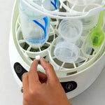Baby Brezza Detergent tablet being put into the Bottle washer pro - product thumbnail