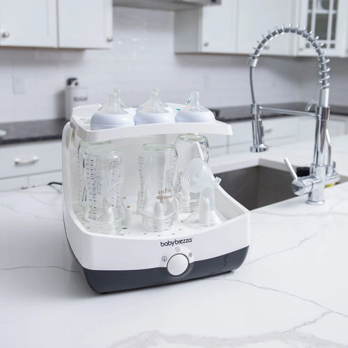 Baby Brezza Superfast sterilizer dryer open with bottles and parts in kitchen - product thumbnail
