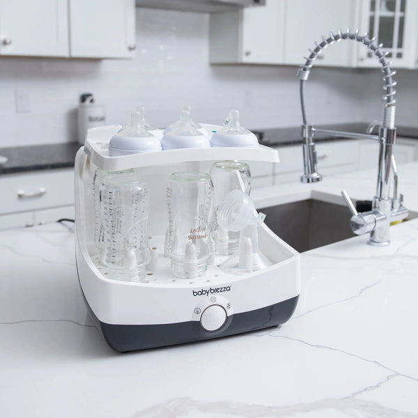 Baby Brezza Superfast sterilizer dryer open with bottles and parts in kitchen - product thumbnail