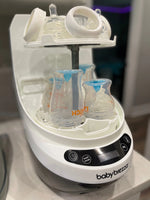 Baby Brezza Bottle washer pro open with bottles and parts in kitchen - product thumbnail