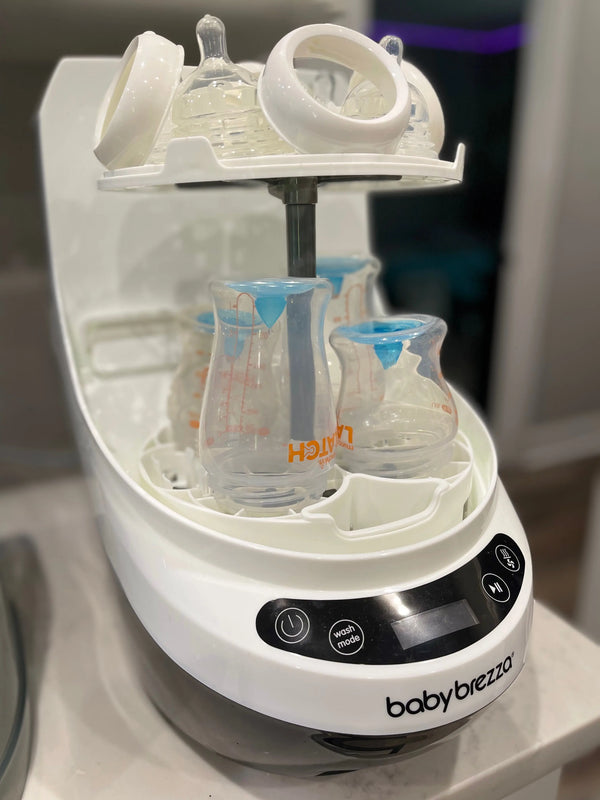 Baby Brezza Bottle washer pro open with bottles and parts in kitchen - product thumbnail