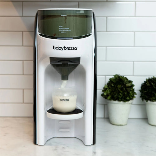 Front view of Formula Pro Advanced placed on a table with decorative miniature plants in the background, showcasing its modern design - product thumbnail