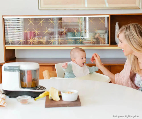 A mother feeding her child by using the Baby Brezza One step food maker - product thumbnail