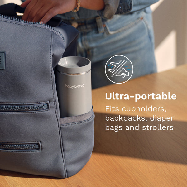EN Gray backpack with a portable warmer on a wooden surface. - product thumbnail